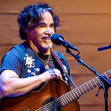 Oates performing in May 2024