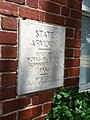 The cornerstone for the Enid Armory reads: "State Armory, built by Works Progress Administration 1936, W.S. Key, State Administrator.