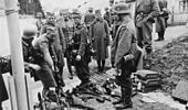 Surrendered Yugoslav troops handing in their weapons