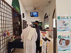 A Friday prayer attendee gets his temperature scanned before entering a mosque in Selangor during the Covid-19 pandemic in 2020.