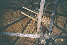 A raftered hipped roof. Axial pole and tie beams are visible