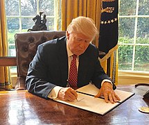 President Trump signs Executive Order 13780, one of several of his travel bans.