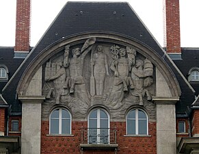 Art Deco pediment of the Carrefour Curie (Quai de Conti no. 1-3), Paris, by Joseph Marrast and Charles Letrosne, 1932[33]