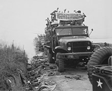 Return of the Prisoners of War during Operation Big Switch, Panmunjom, Korea. Communist Prisoners of War ripped off... - NARA - 520998.jpg