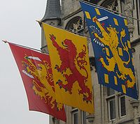 A town hall in the Netherlands displaying heraldic banners