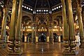 A very well lit Durbar Hall (ceremonial meeting hall of the royal court) of Mysore Palace during the day