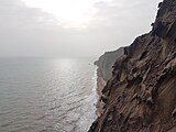 The sea cliffs near the Valley of Statues of Hormuz Island
