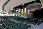 Saratoga Performing Arts Center is an open-air amphitheatre, but has a roof and two stories of seating.