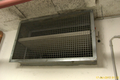 German fire damper in underground parking of a commercial building.