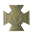 Bronzen Kruis Rijksmunt koning achterzijde