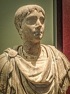 Portrait of a young man with hairstyle, facial features and long neck pointing to portraits made in the early 100s CE