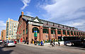 The St. Lawrence Market is a busy indoor market. Many people buy fresh produce, meat, and seafood here.