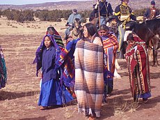 Navajo Indians in period dress for late 1860s, being escorted by white soldiers