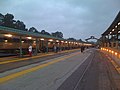 A northward facing view showing the passenger platforms (left) and freight platform (right), as well as the station building