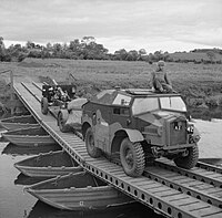 25-pdr field gun and limber being towed by a Morris Commercial Quad