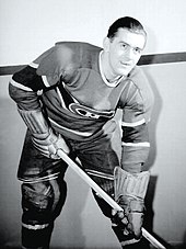 Richard dressed in hockey gear and team uniform