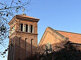 Tower and rose window of All Saints, Shanghai, distinctly Neo-Romanesque