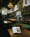 The Gail Kern Paster Reading Room at the Folger Shakespeare Library, with bookshelves decorated with the coat of arms