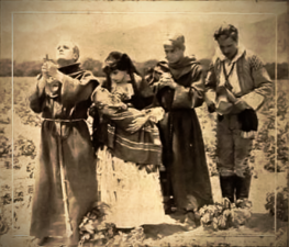 Jose and Carmen receive Padre's blessing.