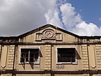 A colonial era building with the Om symbol (1930)