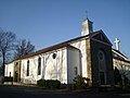 The original St. Thomas Moore Church in Lake Ariel, the new church is in the background