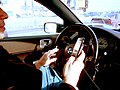 Image 46A driver using two handheld mobile phones at once (from Mobile phone)