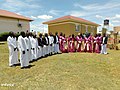 Baganda people in their cultural outfits. Men put on Kanzu, and ladies Ggomeesi in Uganda