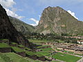 The mountain Pinkuylluna (on the right) above the town Ollantaytambo. A huge face of stone is visible beside the Pinkuylluna ruins.