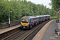 A First TransPennine Express Class 185 passes through the station.