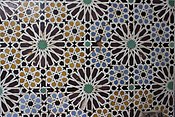 Twelve-pointed star motifs in zellij tilework at the Saadian Tombs in Marrakesh, Morocco (16th century)