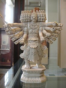 A statue of Ravana with several heads and over a dozen arms