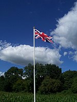 Flagpole of modest size, with simple truck