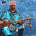 Image 20A Gnawa street performer wearing traditional Gnawi clothing in Rabat's Qasbat al-Widaya (from Culture of Morocco)