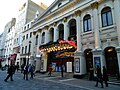 Image 72Music hall evolved into variety shows. First performed in 1912, the Royal Variety Performance was first held at the London Palladium (pictured) in 1941. Performed in front of members of the Royal Family, it is held annually in December and broadcast on television. (from Culture of the United Kingdom)