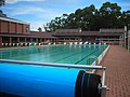 Old Olympic length 8 lane pool, now the location of two basketball courts