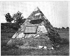 Monument erected 1904 by the Jackson Iron Company at the site of the discovery of ore after destruction of the stump. The monument is now located on US 41.[11]