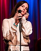 Woman singing in the Grammy Museum