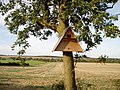 A triangle-shaped birdbox.