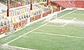 Stretford End of Old Trafford in Manchester (1992). In soccer, the goal line is the boundary of the smaller rectangle that touches the goal as seen in the picture.