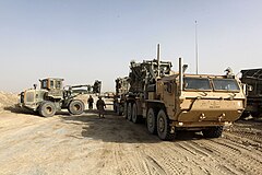 Photographed in Helmand Province, Afghanistan, this MK18 LVSR cargo variant is towing a M1076 PLST