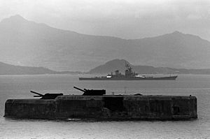 Fort Drum in 1983, with USS New Jersey (BB-62) in the background