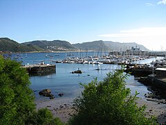 View of the harbour with the civilian yacht moorings in the foreground and the naval base to the right in the background.