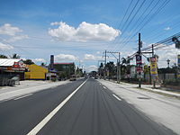 MacArthur Highway (N2) looking south, which serves as a main street of the town