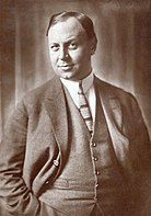 A portrait of Emil Jannings. He wears a suit.