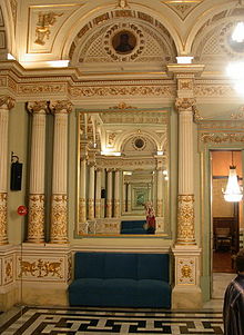 An ornate hall with a tiled floor