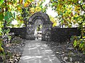 Temple enclosure wall and gate constructed using rubble stone masonry[14] with native teak trees