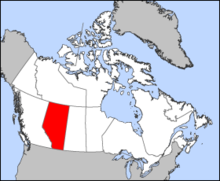 Un mapa blanca de Canada, con Alberta colorida roja.