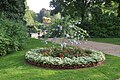 Flower bed with Plumbago and Lily-shaped border stones