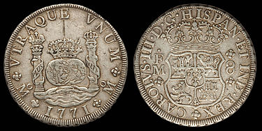 A silver coin depicting pillars, a globe and a coat of arms