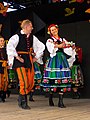 A man and woman wearing regional Łowicz-style folk dress in Poland